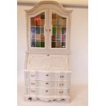 A Continental painted bureau bookcase , with leaded light doors, a fall front with fitted interior