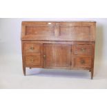 A C19th French fruitwood fall front bureau over four drawers and a cupboard, 50½" x 18", 39½" high