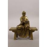 A Chinese gilt bronze figure of Buddha seated on an altar bench, 5" wide, 5½" high