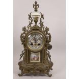 A French brass cased mantel clock with hand painted porcelain dial, decorated with a cherub and