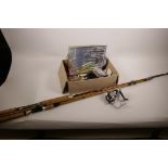Two fishing rods and a quantity of fishing equipment including reel, floats etc