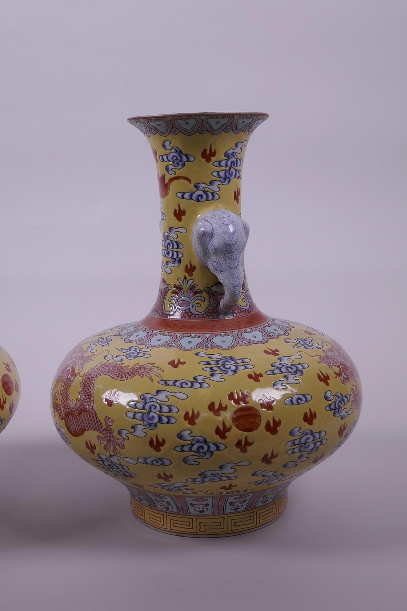 A pair of Chinese yellow ground vases with two elephant head handles and iron red dragon decoration, - Image 4 of 5
