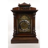 An oak cased mantel clock with brass dial, the movement striking on a gong, A/F, 11½" x 6", 17" high