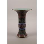 A Chinese polychrome porcelain Gu shaped vase with floral decoration, seal mark to base, 9" high