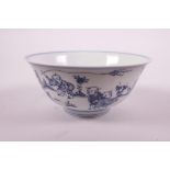 A Chinese blue and white porcelain rice bowl decorated with boys flying kites in a garden, Ming 6