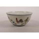 A Chinese doucai enamelled porcelain tea bowl with chicken decoration, 6 character mark to base,