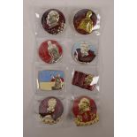 A collection of eight Chinese enamelled metal badges depicting Mao, character inscriptions verso,