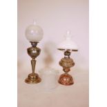 A Victorian brass oil lamp with etched glass shade and twin duplex wicks, with extra shade, and