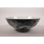 A large Chinese blue and white porcelain bowl with underglaze dragon decoration, 6 character mark to