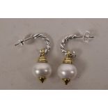 A pair of two tone silver and freshwater pearl drop earrings