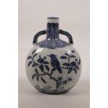 A small Chinese blue and white porcelain moon flask with two handles, decorated with birds perched