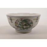 A Chinese doucai porcelain rice bowl decorated with dragons, 4½" diameter
