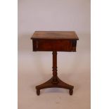 A C19th mahogany work box with a single drawer, raised on a turned column and triform base, 17" x