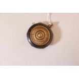 An Oriental horn snuff bottle with brass mounts, 2" diameter
