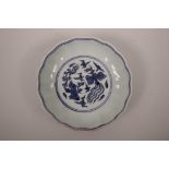 A Chinese blue and white porcelain bowl with lobed rim, sang de boeuf glazed exterior and phoenix