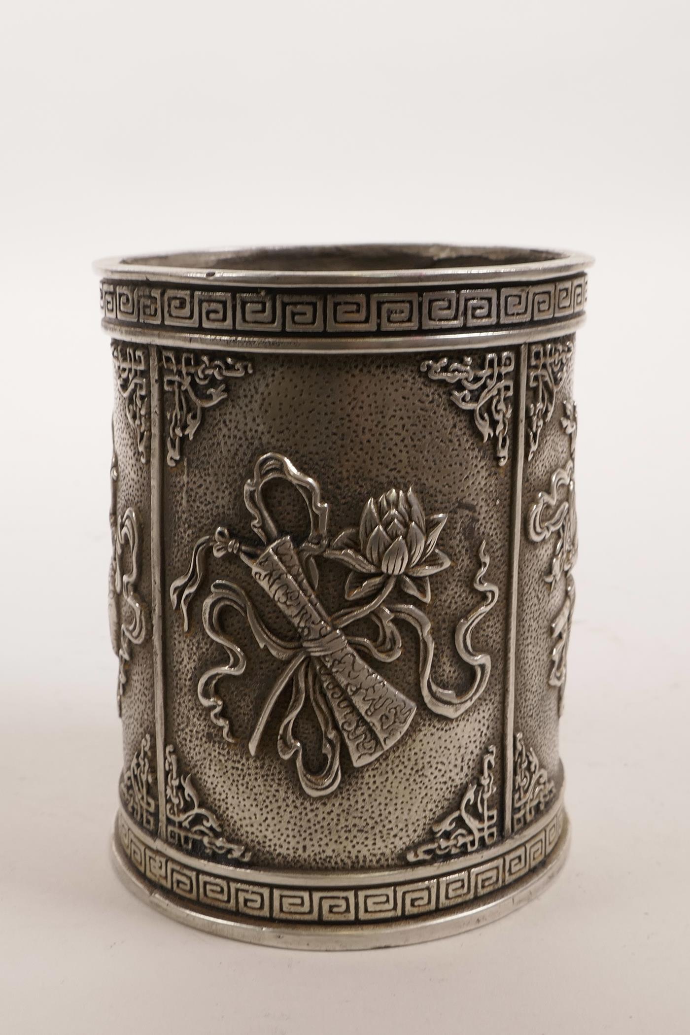 A Chinese white metal brush pot decorated with the emblems of the Eight Immortals, impressed mark to - Image 4 of 5