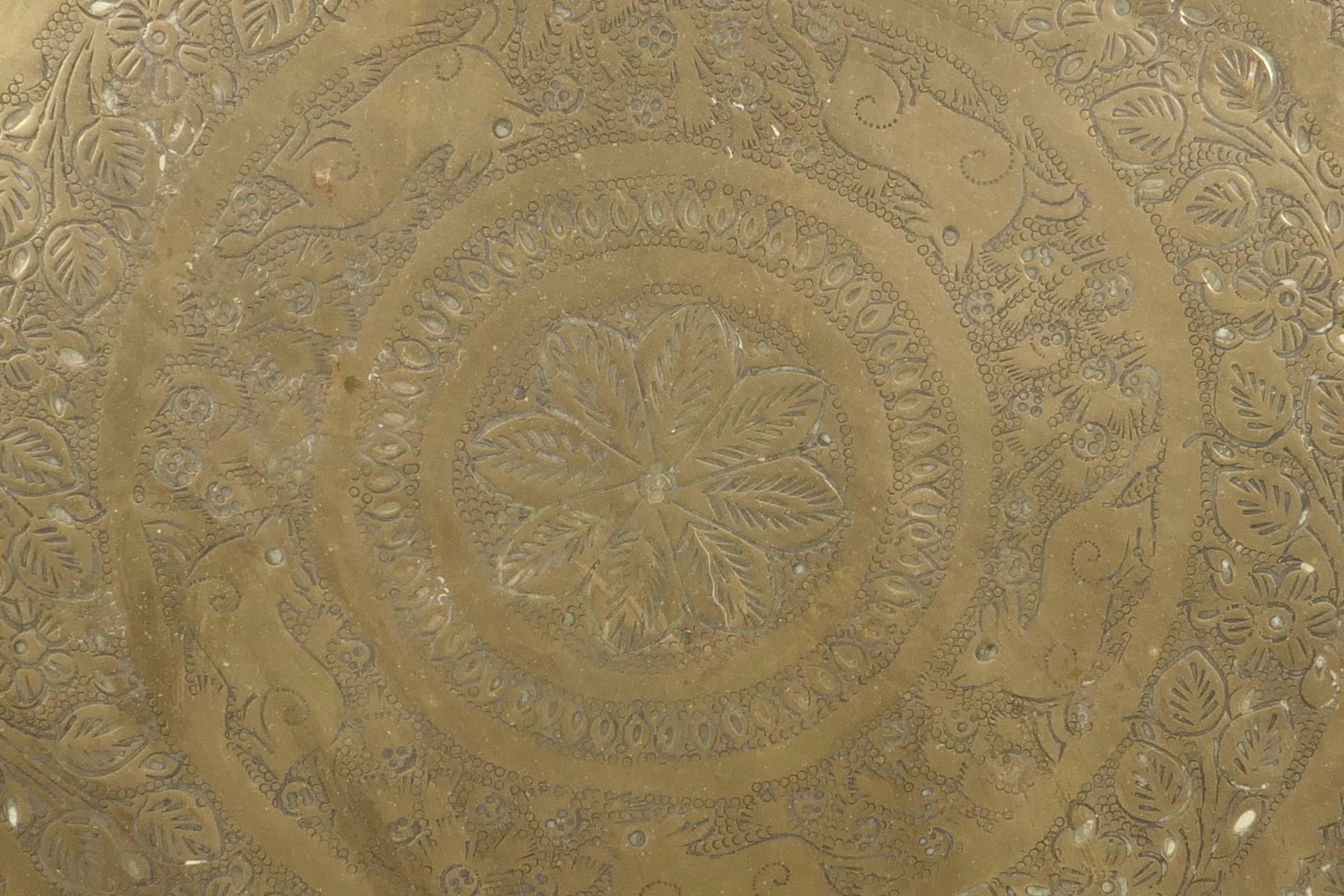 A large Indian brass tray with chased figural and animal decoration, 23" diameter - Image 6 of 6