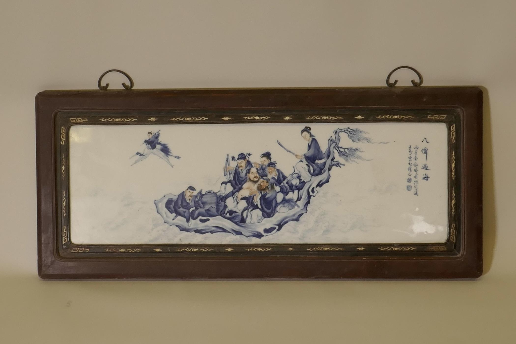 A large Chinese blue and white porcelain panel decorated with The Eight Immortals travelling at sea,