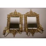 A pair of ormolu two branch wall sconces in the Renaissance Revival style, 11½" x 20"