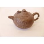 A Yixing teapot, the cover with reticulated dragon's head, indistinctly marked, 3" high