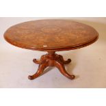 A C19th burr walnut breakfast table with marquetry inlaid top, raised on a carved column and