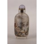 A Chinese reverse painted glass snuff bottle decorated with figures in a landscape and scribe's