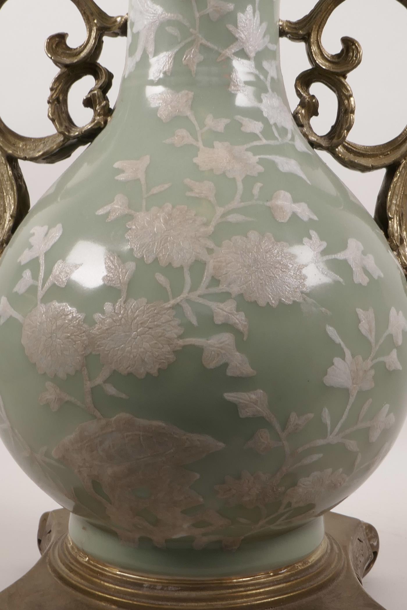 A Chinese celadon ground porcelain vase with later applied ormolu mounts and handles, and white - Image 4 of 6