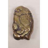 A brass vesta case in the form of a bird catching a toad, 1½" x 2½"