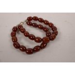 A twin strand honey amber bead bracelet, 16" long