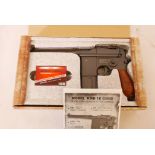 A replica M712 Broomhandle BB pistol in box, 11" long