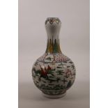 A Chinese wucai porcelain garlic head shaped vase, decorated with dragons chasing the flaming pearl,