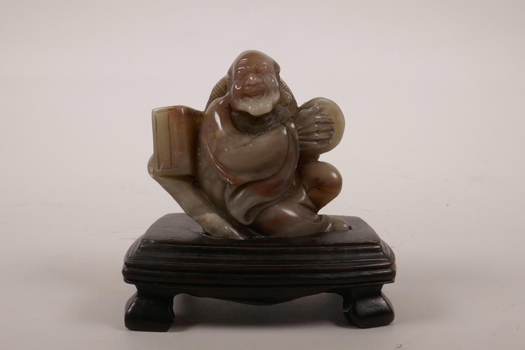 A Chinese soapstone carving of lohan, 4" high