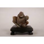 A Chinese soapstone carving of lohan, 4" high