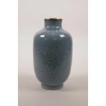 A Chinese duck egg blue glazed porcelain vase with underglaze prunus decoration, seal mark to