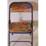 A folding metal chair painted with an advertisement for Billy Smart's Circus