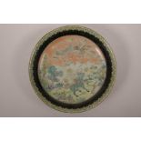 A Chinese famille verte porcelain cabinet plate decorated with a kylin and phoenix in a landscape, 6