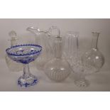 A Blue overlay flash cut glass tazza, 7" high, together with two cut glass mallet shaped carafes,