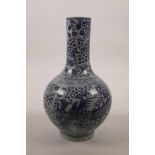 A Chinese blue and white porcelain bottle vase with phoenix decoration, mark to base, 10" high