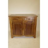 A late C18th French inlaid walnut buffet, with two drawers over two cupboards, raised on shaped