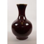 A Chinese flambé glazed pottery vase, 13" high