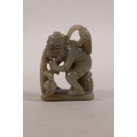 A Chinese celadon jade carving of a fisherman, 2½" high