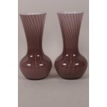 A pair of Art Glass specimen vases with swirled lilac body over white interior, 6" high