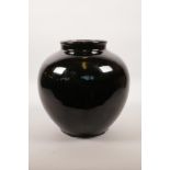 A Chinese treacle glazed pottery vase, 8½" high