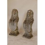 A pair of mid C20th concrete garden lions, 32" high