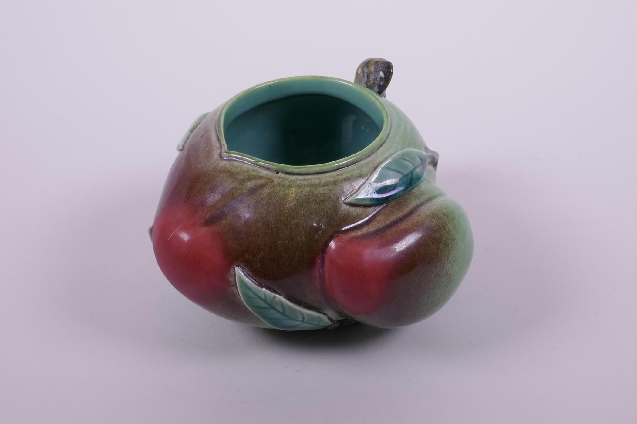 A Chinese polychrome porcelain ink/water pot in the form of a peach, impressed seal mark to base, 5"