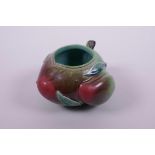 A Chinese polychrome porcelain ink/water pot in the form of a peach, impressed seal mark to base, 5"