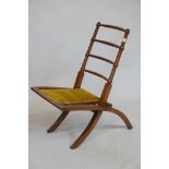 A child's folding footrest with ladder back, early C20th