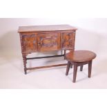 A vintage oak side cabinet with single cupboard with fielded panels on bobbin turned supports and