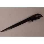 An ebony letter opener, the handle in the form of a hippopotamus, 10" long