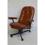 An Everstyle tilt and recline easy chair, with pull out footrest and leatherette covers
